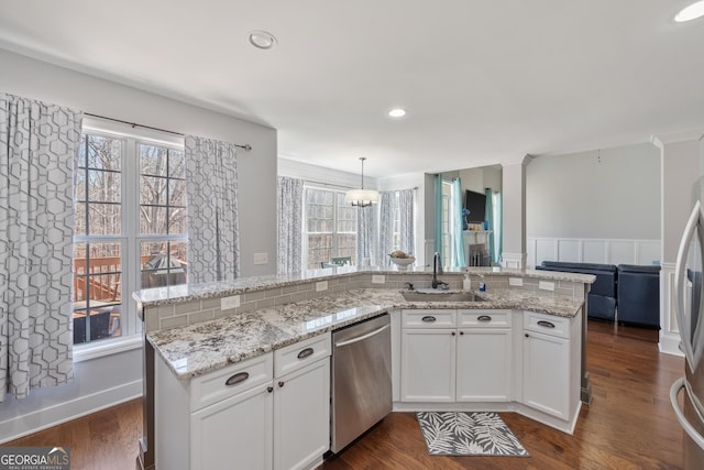 2995 Barimore Pl, Dacula, GA 30019 - kitchen with dishwasher, healthy amount of natural light, white cabinets, light stone counters, and recessed lighting