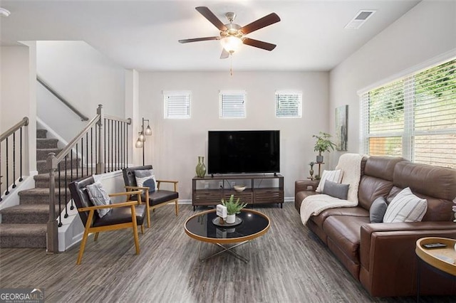 152 Malbone St SW, Cartersville, GA 30120 - living room featuring ceiling fan, wood finished floors, and stairway