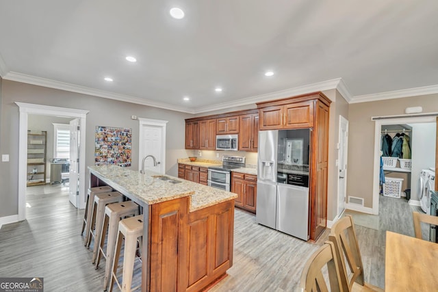 2717 Old Eastman Rd, Cadwell, GA 31009 - kitchen featuring stainless steel appliances, light wood-style floors, baseboards, recessed lighting, and ornamental molding