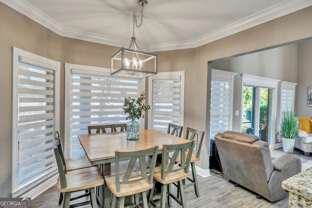 2717 Old Eastman Rd, Cadwell, GA 31009 - dining space with ornamental molding, a chandelier, light wood-style floors, and baseboards
