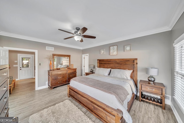 2717 Old Eastman Rd, Cadwell, GA 31009 - bedroom with crown molding, light wood finished floors, baseboards, and ceiling fan