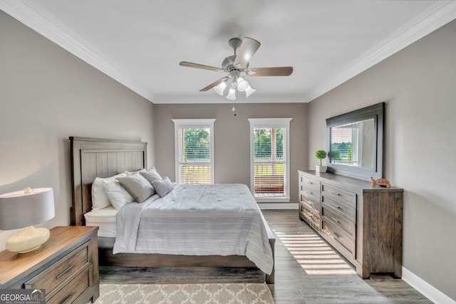 2717 Old Eastman Rd, Cadwell, GA 31009 - bedroom with multiple windows, wood finished floors, baseboards, ornamental molding, and ceiling fan