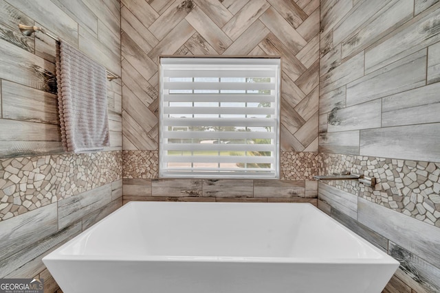 2717 Old Eastman Rd, Cadwell, GA 31009 - bathroom with a soaking tub and healthy amount of natural light