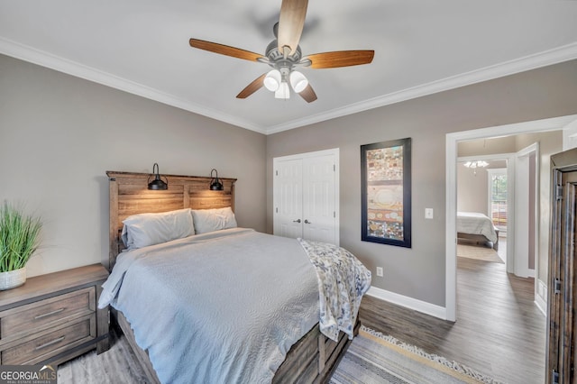 2717 Old Eastman Rd, Cadwell, GA 31009 - bedroom with wood finished floors, baseboards, ornamental molding, a closet, and ceiling fan