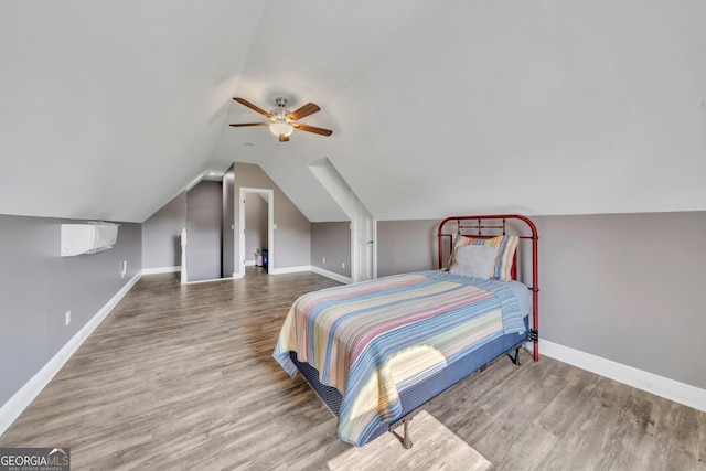 2717 Old Eastman Rd, Cadwell, GA 31009 - bedroom featuring baseboards, wood finished floors, vaulted ceiling, and a ceiling fan