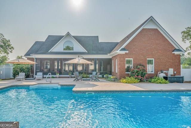 2717 Old Eastman Rd, Cadwell, GA 31009 - view of swimming pool with a sunroom and a patio area