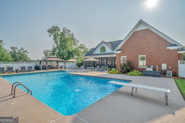 2717 Old Eastman Rd, Cadwell, GA 31009 - view of pool with a gazebo, a patio area, a fenced backyard, and a diving board