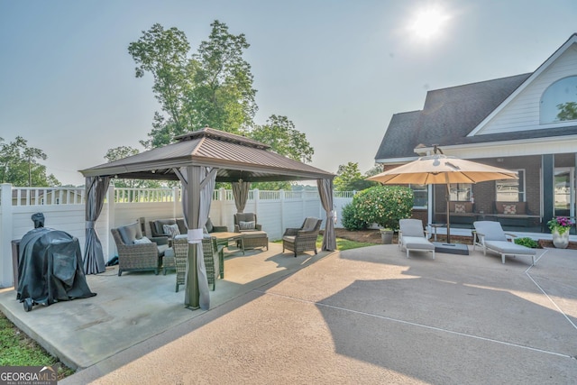 2717 Old Eastman Rd, Cadwell, GA 31009 - fenced backyard featuring a gazebo, a patio, and an outdoor hangout area
