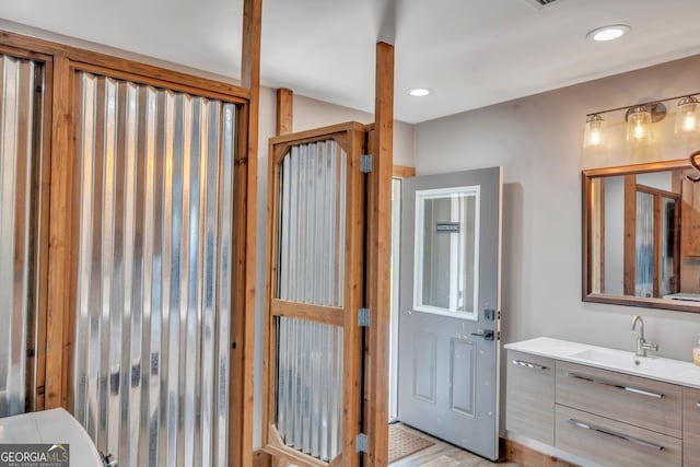 2717 Old Eastman Rd, Cadwell, GA 31009 - bathroom featuring vanity, recessed lighting, and wood finished floors