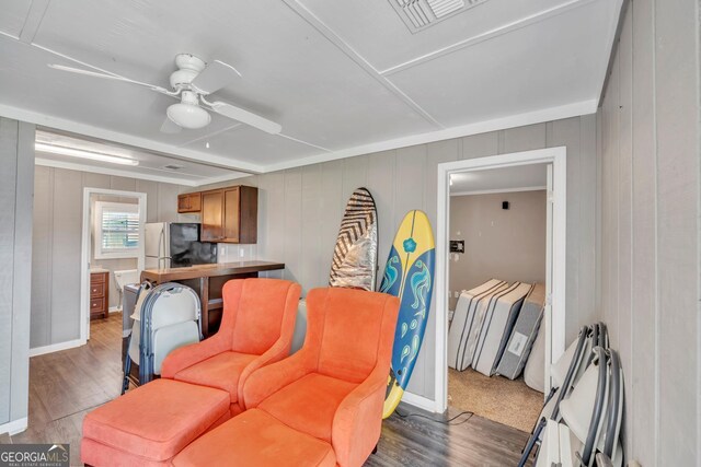2717 Old Eastman Rd, Cadwell, GA 31009 - living area featuring a ceiling fan, wood finished floors, and baseboards