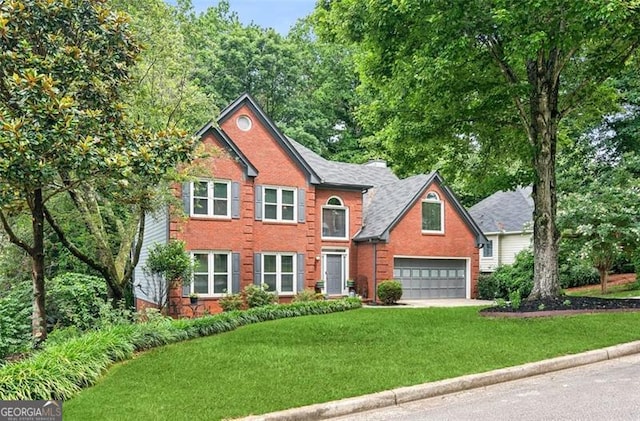 2220 Cape Courage Way, Suwanee, GA 30024 - view of front of property featuring brick siding, a front lawn, and driveway