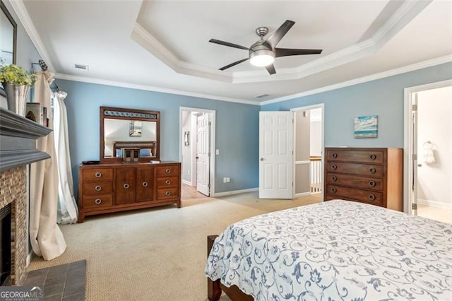 2220 Cape Courage Way, Suwanee, GA 30024 - carpeted bedroom with a raised ceiling, a fireplace with flush hearth, ornamental molding, connected bathroom, and baseboards