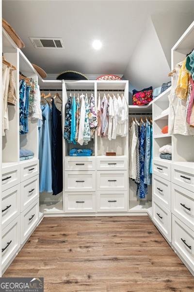 2220 Cape Courage Way, Suwanee, GA 30024 - spacious closet with light wood-style flooring