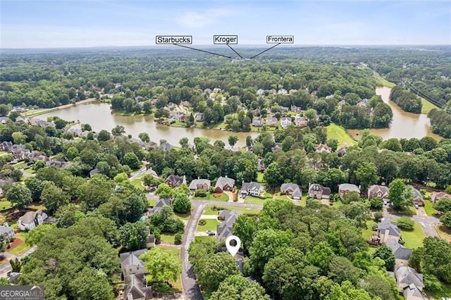2220 Cape Courage Way, Suwanee, GA 30024 - drone / aerial view of a nearby body of water and a heavily wooded area