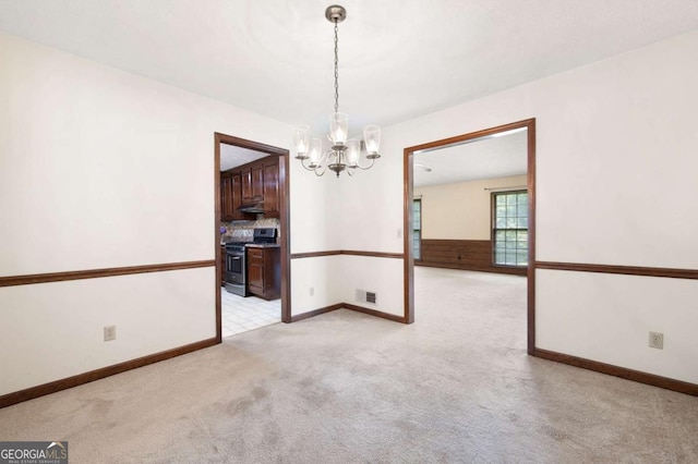 272 Creek Ct SW, Marietta, GA 30064 - spare room featuring a chandelier, light carpet, and baseboards