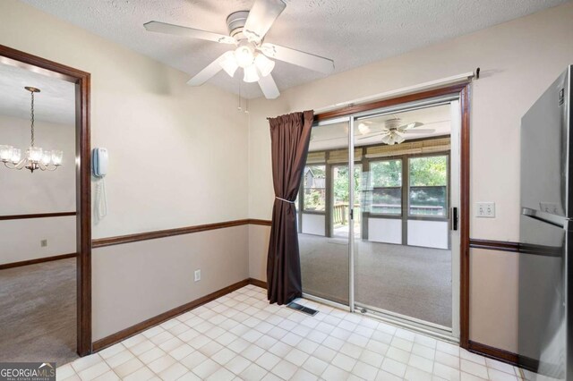 272 Creek Ct SW, Marietta, GA 30064 - empty room featuring ceiling fan, baseboards, a chandelier, and a textured ceiling