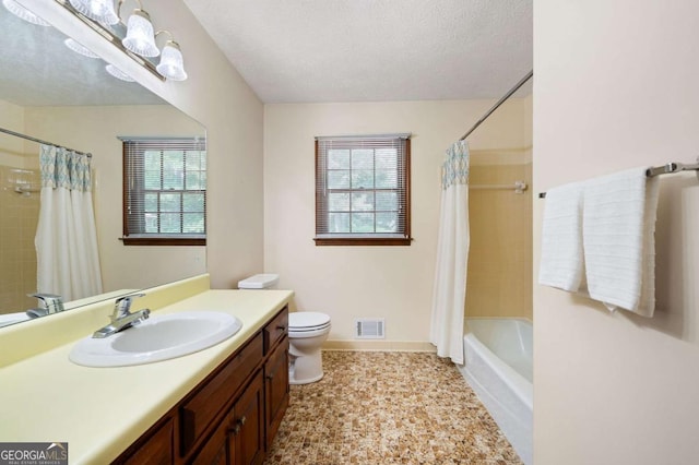 272 Creek Ct SW, Marietta, GA 30064 - bathroom featuring healthy amount of natural light, vanity, toilet, shower / bath combo, and a textured ceiling