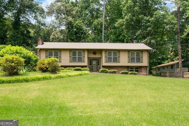 272 Creek Ct SW, Marietta, GA 30064 - raised ranch featuring a chimney, a front yard, and view of scattered trees