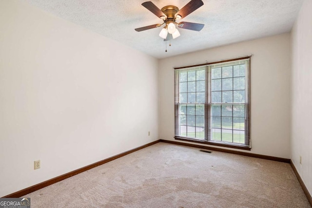 272 Creek Ct SW, Marietta, GA 30064 - unfurnished room featuring carpet flooring, a textured ceiling, baseboards, and ceiling fan