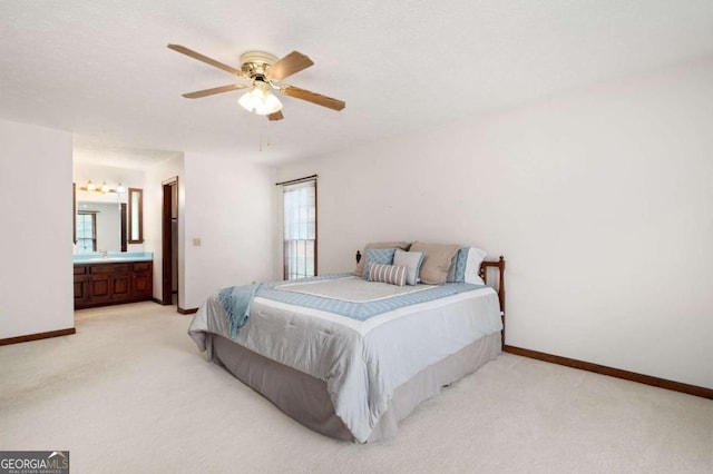 272 Creek Ct SW, Marietta, GA 30064 - bedroom featuring light carpet, a sink, baseboards, and ensuite bathroom
