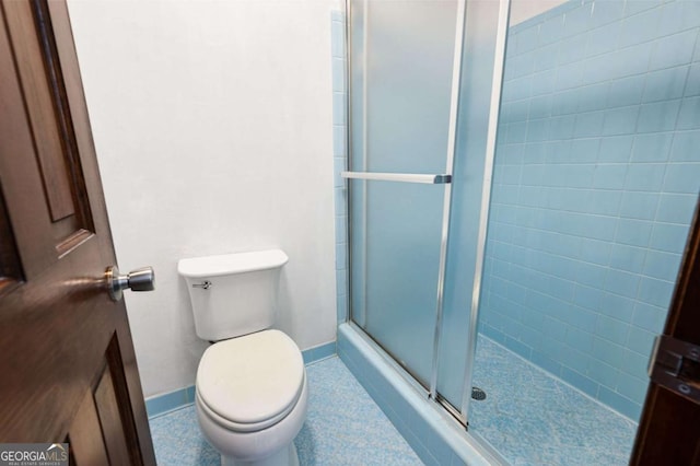 272 Creek Ct SW, Marietta, GA 30064 - full bathroom featuring baseboards, a shower stall, and toilet