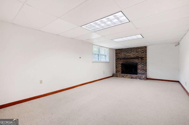 272 Creek Ct SW, Marietta, GA 30064 - unfurnished living room featuring light carpet, a brick fireplace, baseboards, and a paneled ceiling