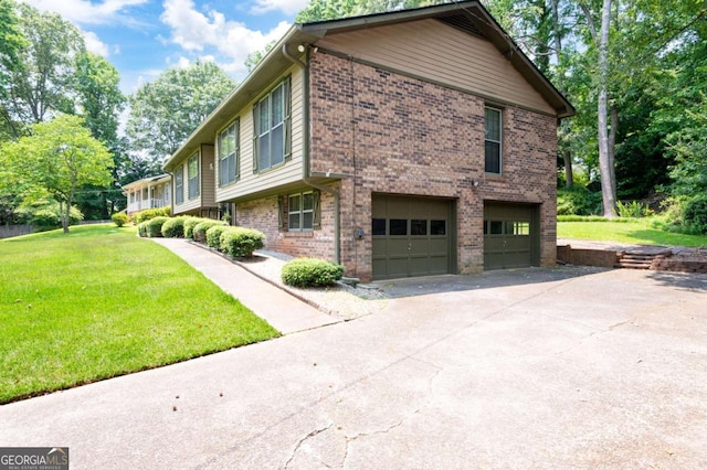 272 Creek Ct SW, Marietta, GA 30064 - view of home's exterior featuring an attached garage, brick siding, driveway, and a yard