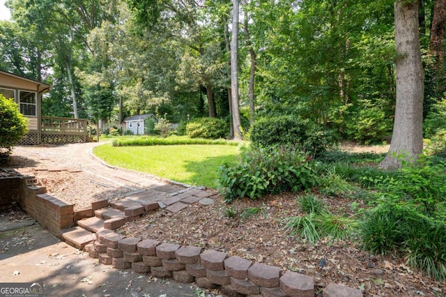 272 Creek Ct SW, Marietta, GA 30064 - view of grassy yard with a deck and an outdoor structure