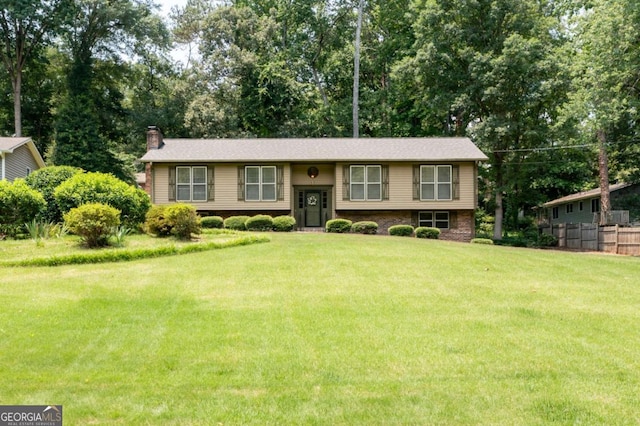 272 Creek Ct SW, Marietta, GA 30064 - bi-level home featuring a chimney and view of scattered trees