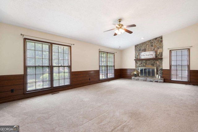 272 Creek Ct SW, Marietta, GA 30064 - unfurnished living room with wainscoting, ceiling fan, wood walls, lofted ceiling, and carpet