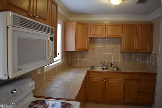 3400 Scott Dr, Austell, GA 30106 - kitchen featuring white appliances, tile counters, decorative backsplash, and crown molding