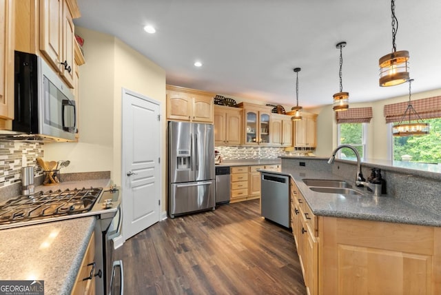 149 Highland Rd S, Dahlonega, GA 30533 - kitchen with stainless steel appliances, light brown cabinetry, a sink, dark wood-style floors, and decorative backsplash