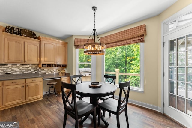149 Highland Rd S, Dahlonega, GA 30533 - dining room featuring a chandelier, plenty of natural light, dark wood-type flooring, and baseboards