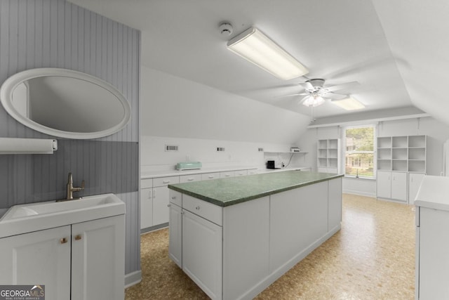 149 Highland Rd S, Dahlonega, GA 30533 - kitchen featuring a sink, a center island, white cabinetry, lofted ceiling, and ceiling fan
