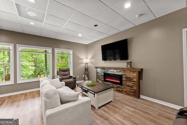 149 Highland Rd S, Dahlonega, GA 30533 - living room with a fireplace, light wood-type flooring, baseboards, a paneled ceiling, and recessed lighting