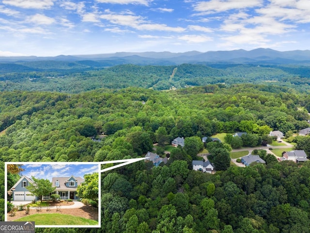 149 Highland Rd S, Dahlonega, GA 30533 - aerial view of property and surrounding area with a heavily wooded area, property parcel outlined, and mountains