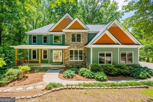 565 Brights Way, Dawsonville, GA 30534 - craftsman inspired home featuring stone siding, a standing seam roof, a porch, and metal roof