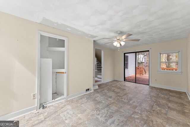 405 Cedar Hollow Rd Unit 2, Cleveland, GA 30528 - unfurnished room featuring stairway, a ceiling fan, stone finish floors, and baseboards