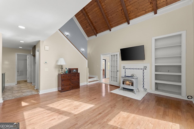 405 Cedar Hollow Rd Unit 2, Cleveland, GA 30528 - living room with wooden ceiling, built in features, wood finished floors, a wood stove, and baseboards