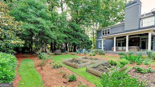 1178 Chambord Way NE, Brookhaven, GA 30319 - view of yard featuring a vegetable garden and a patio area