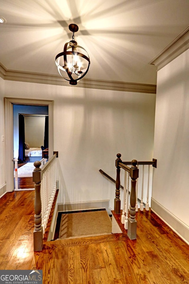 1178 Chambord Way NE, Brookhaven, GA 30319 - staircase with a chandelier, wood finished floors, baseboards, and crown molding