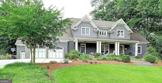 1178 Chambord Way NE, Brookhaven, GA 30319 - view of front of property featuring a porch, a front yard, concrete driveway, a standing seam roof, and brick siding