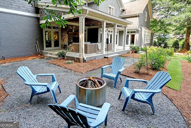 1178 Chambord Way NE, Brookhaven, GA 30319 - view of patio / terrace with a fire pit, french doors, and ceiling fan