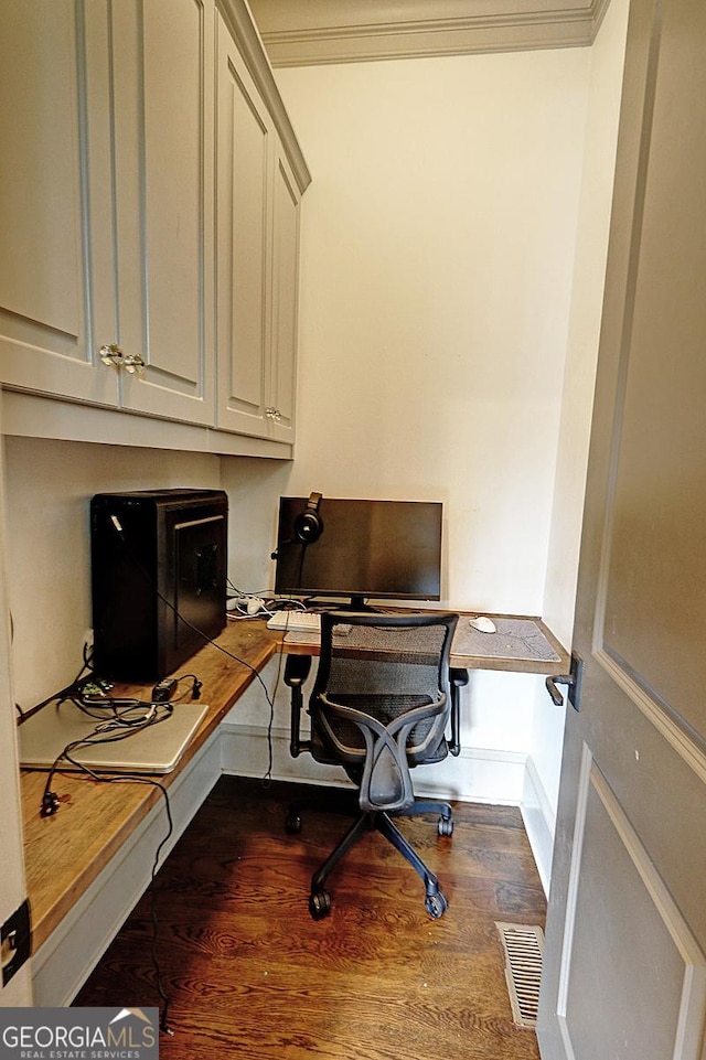 1178 Chambord Way NE, Brookhaven, GA 30319 - home office with dark wood finished floors, ornamental molding, and built in desk
