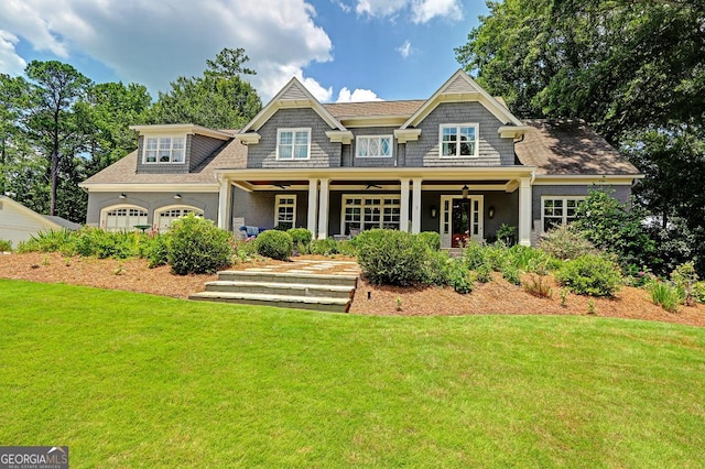 1178 Chambord Way NE, Brookhaven, GA 30319 - back of house featuring a lawn, ceiling fan, covered porch, and an attached garage