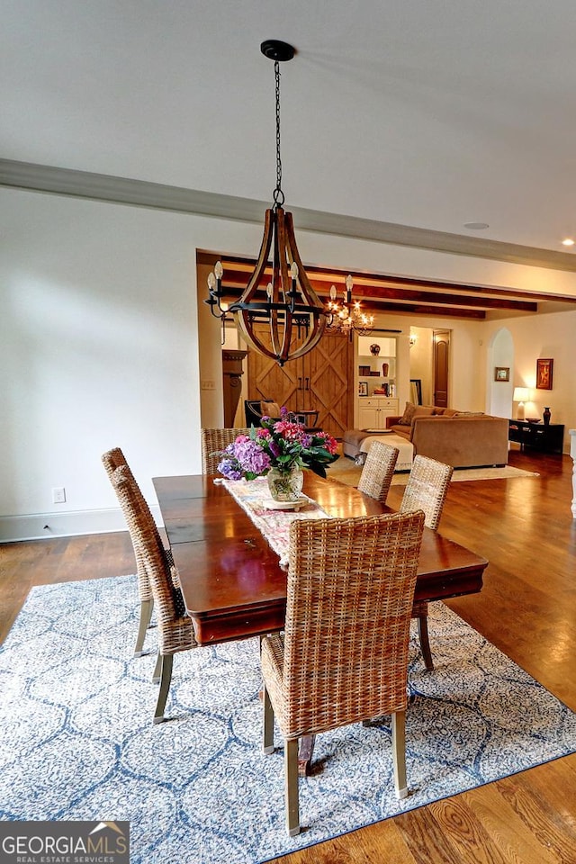 1178 Chambord Way NE, Brookhaven, GA 30319 - dining room with a chandelier, ornamental molding, baseboards, and wood finished floors