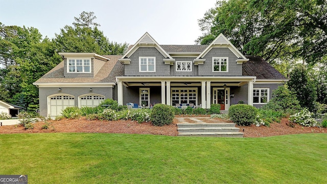 1178 Chambord Way NE, Brookhaven, GA 30319 - view of front of house featuring a front lawn, covered porch, a garage, and roof with shingles