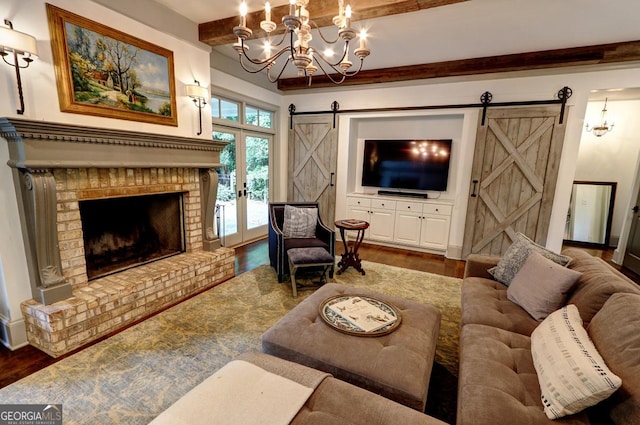 1178 Chambord Way NE, Brookhaven, GA 30319 - living area featuring a barn door, beamed ceiling, wood finished floors, a chandelier, and a fireplace