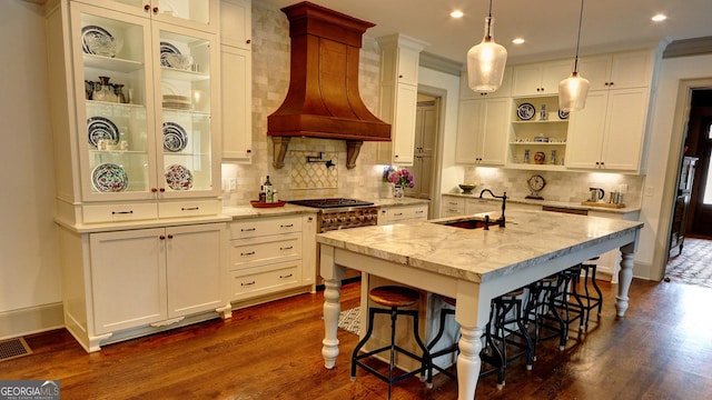 1178 Chambord Way NE, Brookhaven, GA 30319 - kitchen featuring custom range hood, a sink, open shelves, dark wood finished floors, and white cabinets