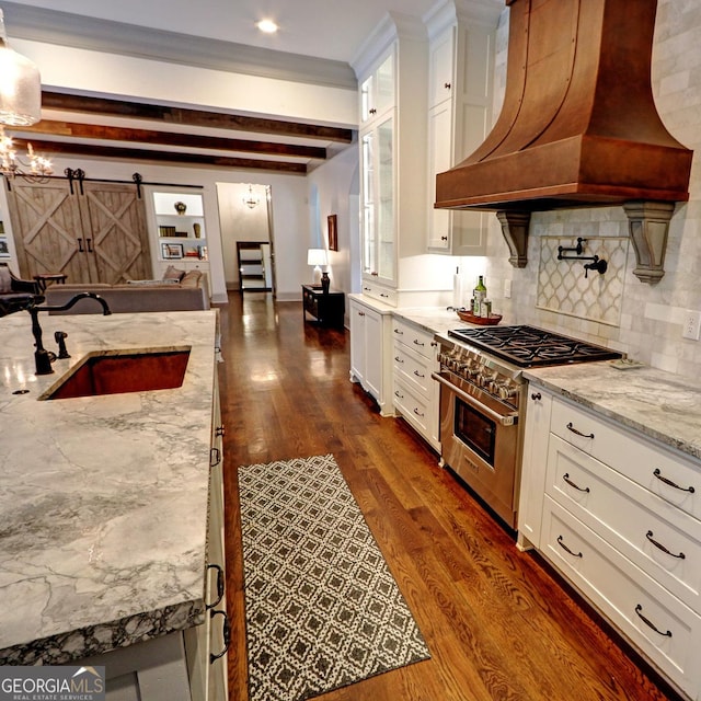 1178 Chambord Way NE, Brookhaven, GA 30319 - kitchen with high end stainless steel range oven, custom range hood, a sink, dark wood-type flooring, and beamed ceiling